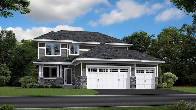 view of front of property with a front lawn and a garage