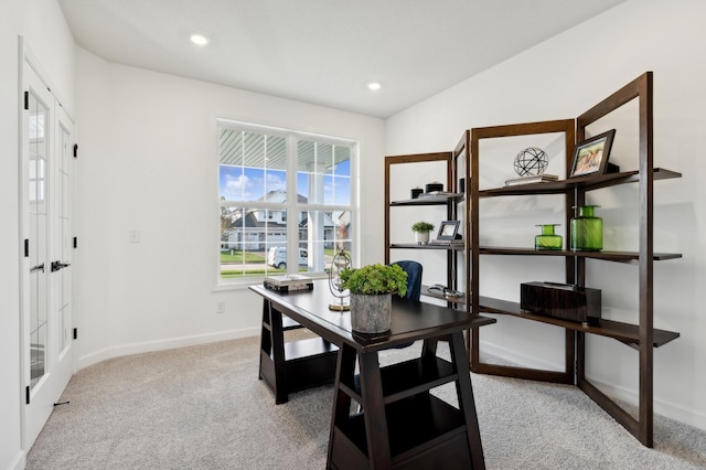 dining area with french doors and light colored carpet