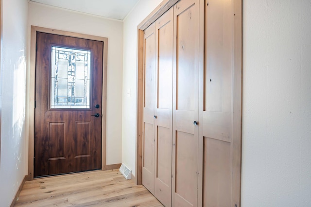 doorway to outside with light hardwood / wood-style floors