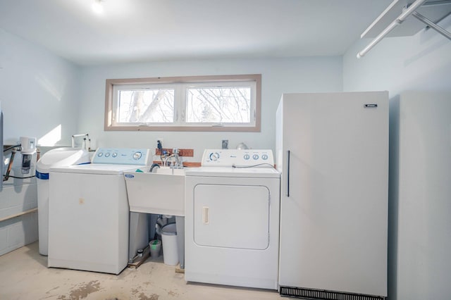 washroom with separate washer and dryer