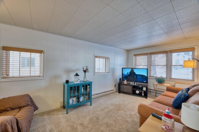 carpeted living room featuring baseboard heating