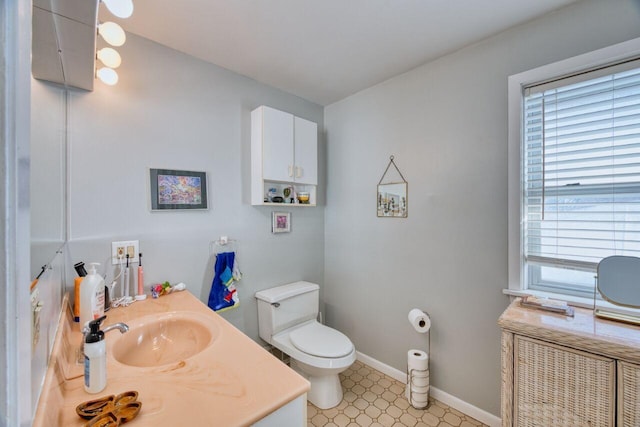 bathroom featuring toilet and vanity