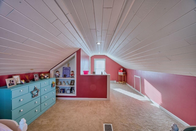 bonus room with lofted ceiling, light carpet, built in shelves, and wood ceiling