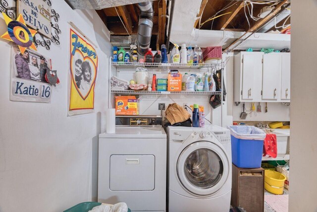 laundry area with washing machine and clothes dryer