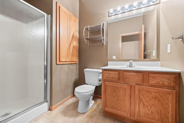 bathroom with an enclosed shower, vanity, and toilet