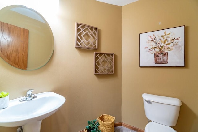 bathroom with toilet and sink