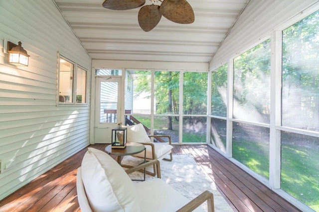 sunroom featuring ceiling fan, plenty of natural light, and vaulted ceiling