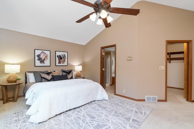 carpeted bedroom featuring a spacious closet, a closet, ceiling fan, and lofted ceiling