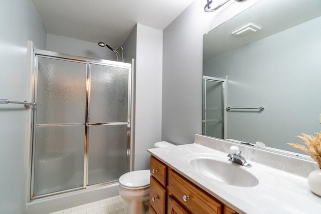 bathroom featuring vanity, toilet, and walk in shower