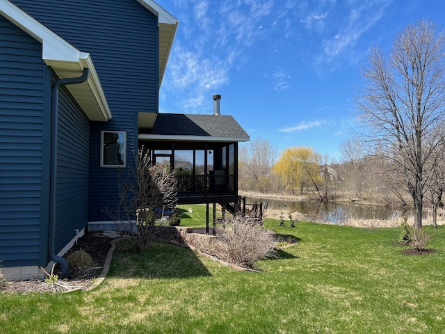 view of yard with a water view