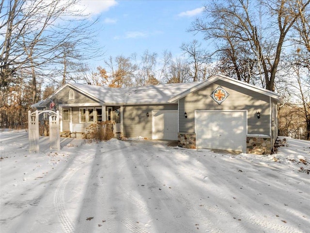 single story home with a garage and covered porch