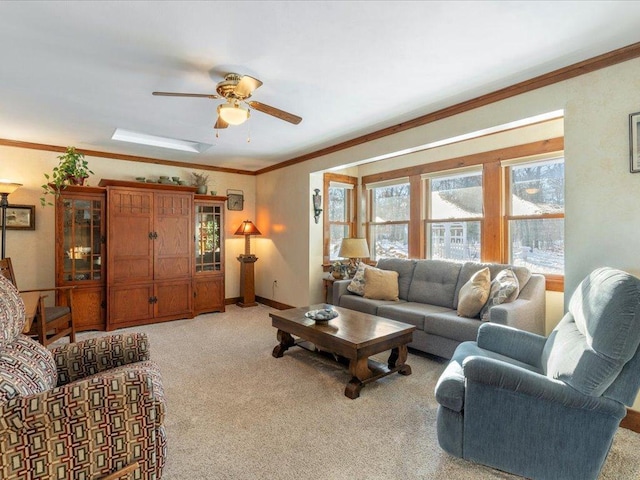 carpeted living room with crown molding and ceiling fan