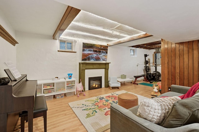 living room with a brick fireplace and hardwood / wood-style floors