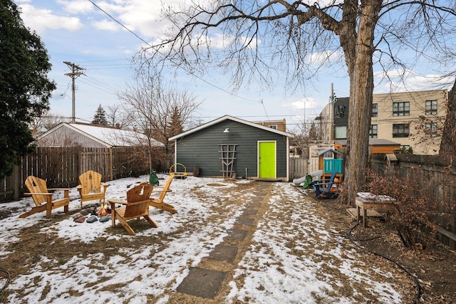 snow covered deck with an outbuilding