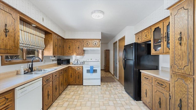 kitchen with white appliances and sink