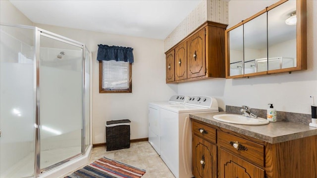 washroom with independent washer and dryer and sink