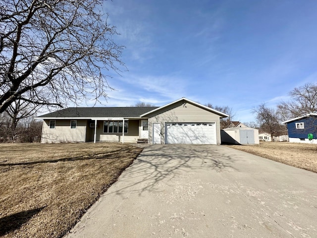 205 Ash St N, Sauk Centre, MN 56378 - ranch-style house featuring a garage, concrete driveway, and a front lawn