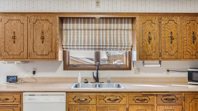 205 Ash St N, Sauk Centre, MN 56378 - kitchen featuring white dishwasher, a sink, wallpapered walls, brown cabinets, and stainless steel microwave