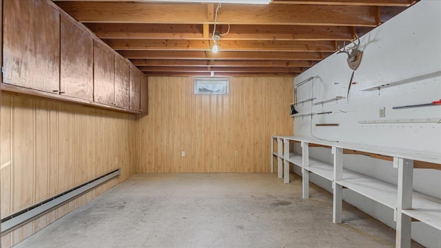 205 Ash St N, Sauk Centre, MN 56378 - below grade area featuring a baseboard radiator and wooden walls