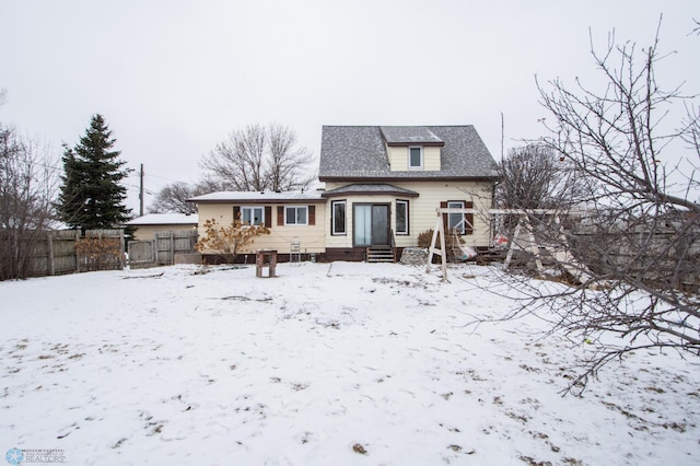 view of snow covered house