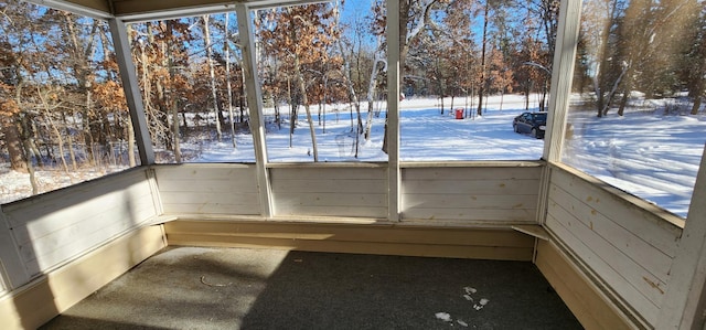 unfurnished sunroom featuring a wealth of natural light