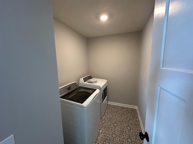 laundry room featuring separate washer and dryer