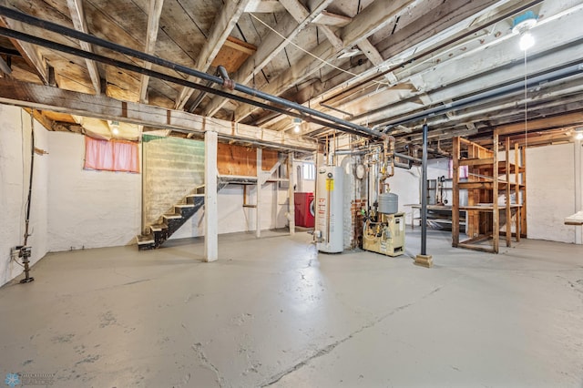 basement featuring a heating unit, water heater, and stairway