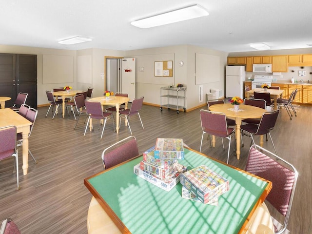 dining area with dark wood-type flooring