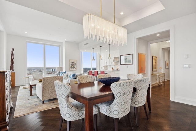 dining room featuring dark parquet flooring