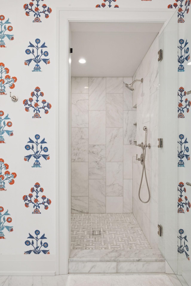 bathroom with tiled shower