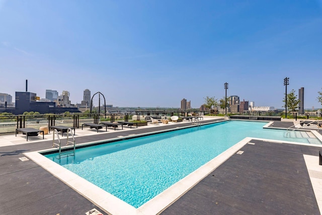 view of swimming pool with a patio