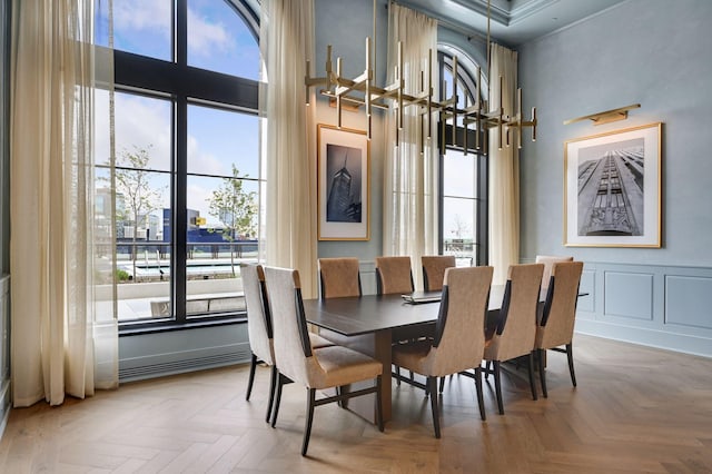 dining area featuring parquet flooring