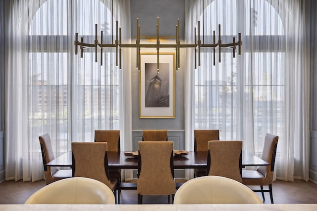 dining area featuring parquet flooring