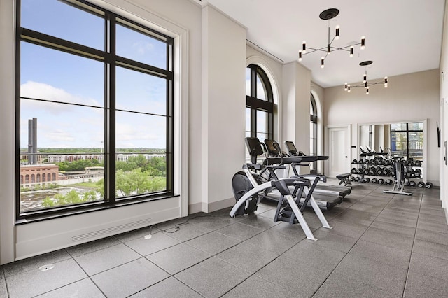 exercise room featuring a chandelier