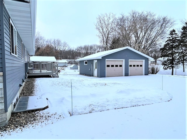 view of snow covered garage