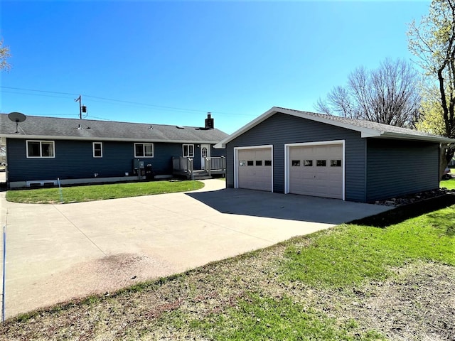 single story home featuring an outdoor structure, a front lawn, and a detached garage