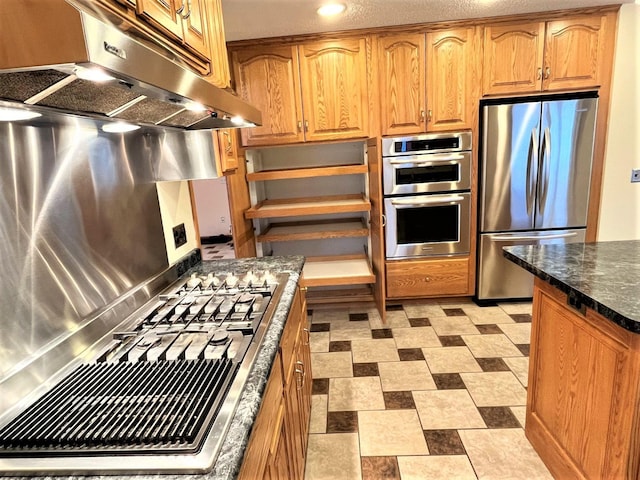 kitchen featuring open shelves, under cabinet range hood, dark stone counters, stainless steel appliances, and recessed lighting