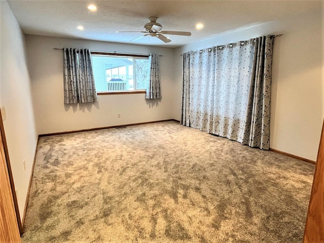 unfurnished room featuring carpet floors, a ceiling fan, and recessed lighting