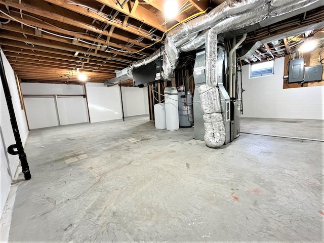 basement featuring heating unit and electric panel