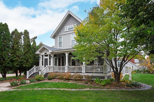 view of front facade with covered porch and a front yard