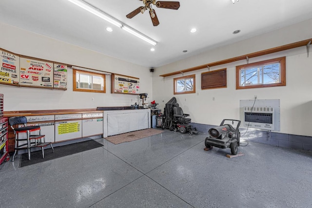 exercise room featuring ceiling fan, recessed lighting, and heating unit