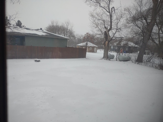 view of yard layered in snow