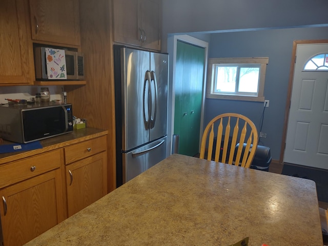 kitchen featuring stainless steel refrigerator