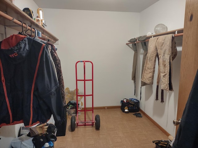 walk in closet featuring light parquet floors