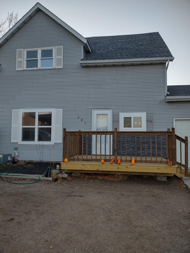 back of property featuring a wooden deck and central air condition unit