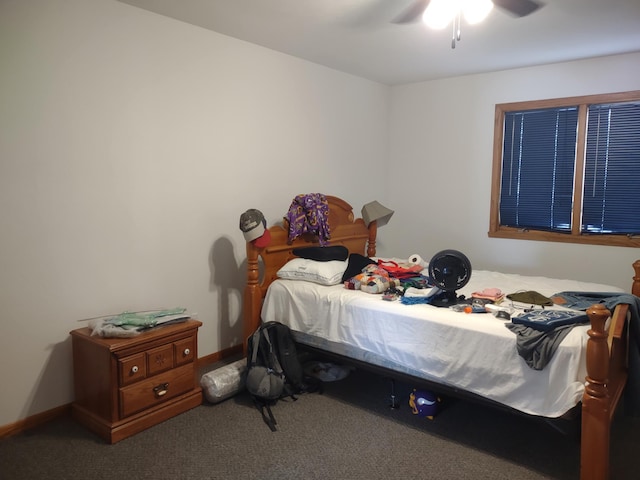 bedroom featuring baseboards, carpet flooring, and a ceiling fan