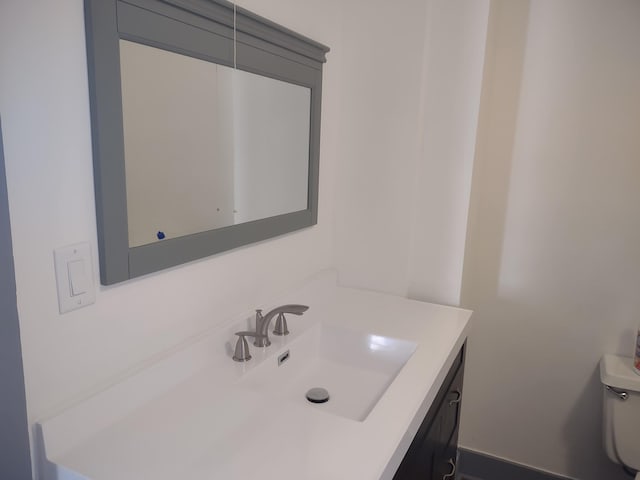 half bathroom featuring vanity