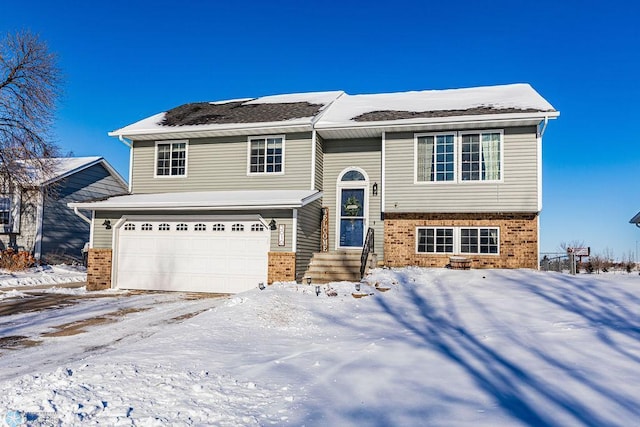 raised ranch featuring a garage