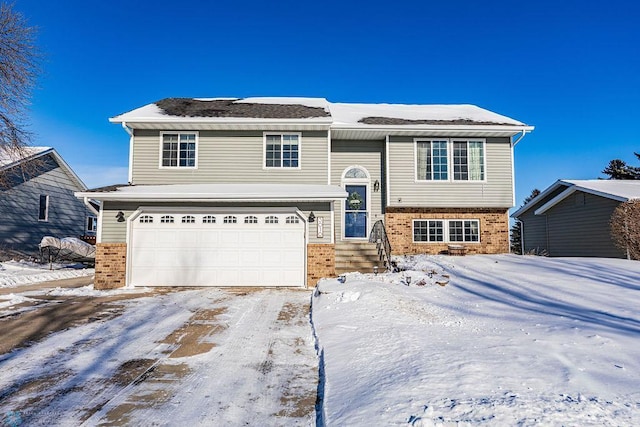 raised ranch featuring a garage