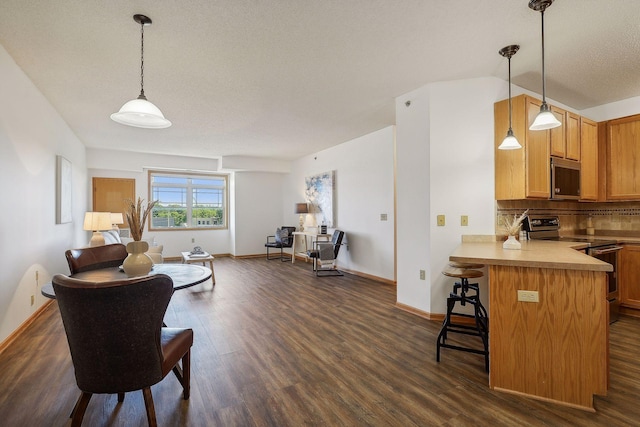 living room with dark hardwood / wood-style floors, lofted ceiling, and a textured ceiling